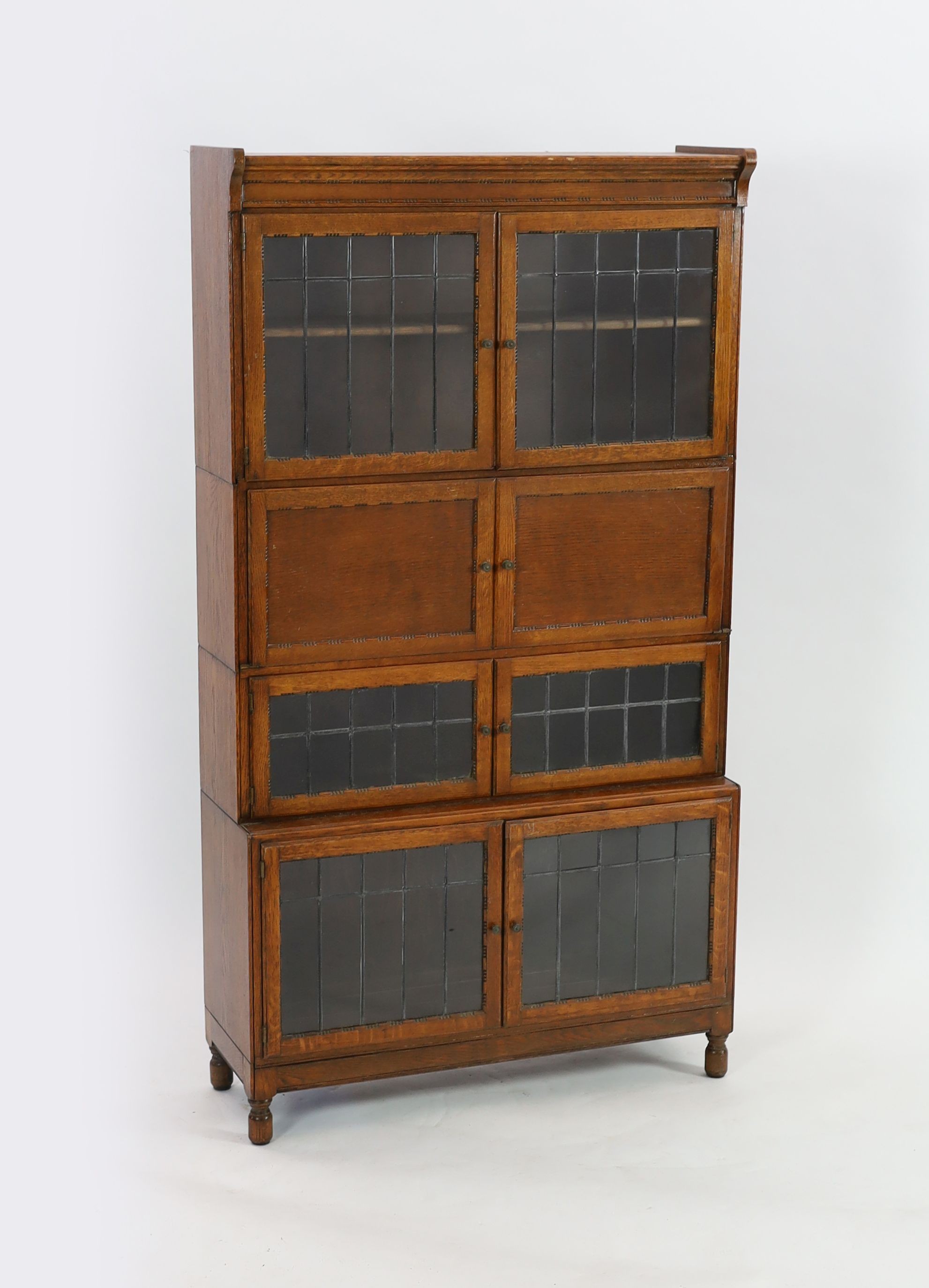 An early 20th century Globe Wernicke style four section bookcase, with leaded glazed doors, width 89cm depth 30cm height 162cm